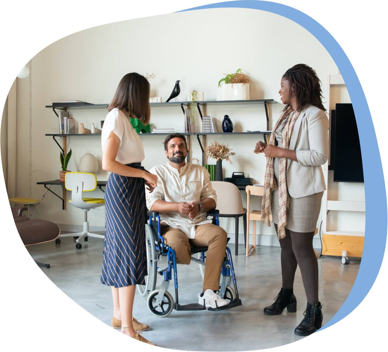 decorative photo of 3 people, one in a wheelchair, in an office setting